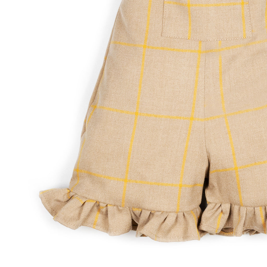 Salopette con volant beige