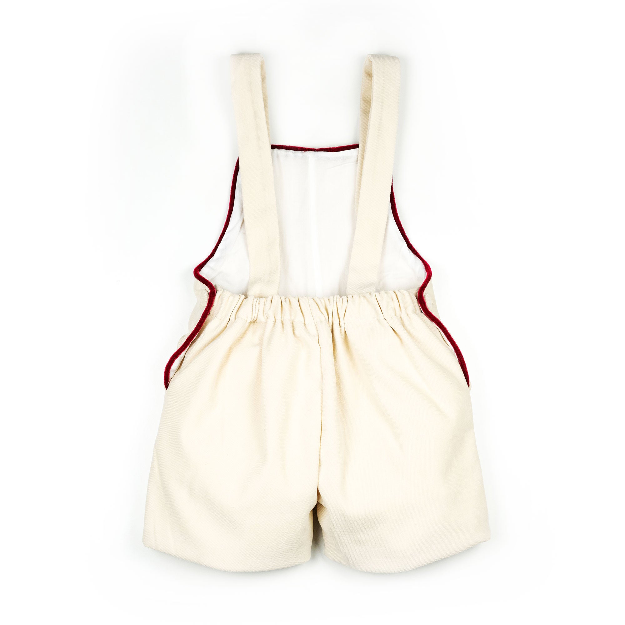 Salopette in velluto panna con profilo rosso