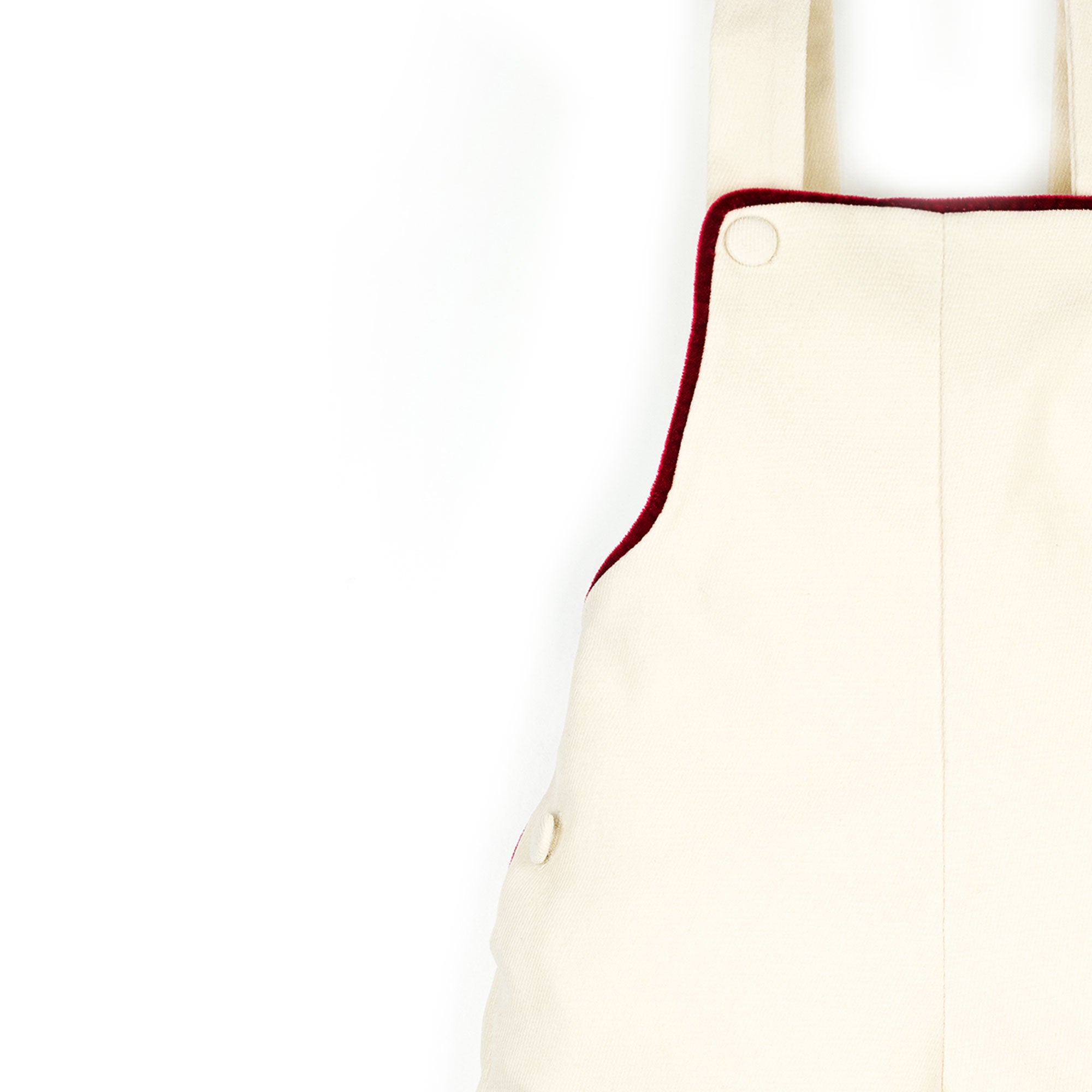 Salopette in velluto panna con profilo rosso