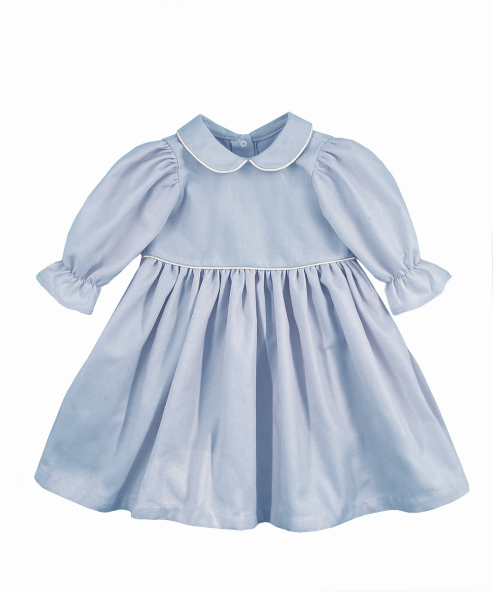 Vestito celeste con manica a sbuffo e profili a contrasto