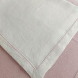 Quadrotto in lino bianco con profilo rosa